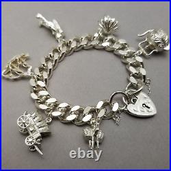 Vintage Solid Sterling Silver Charm Bracelet Hallmarked 1974 18cm (7) 75.3g