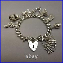 Vintage Solid Sterling Silver Charm Bracelet Hallmarked 1978 18cm (7) 62.9g