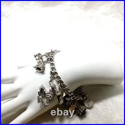 Vintage Sterling Silver 16 Pieces Charm 7.5 Bracelet 46.6 Grams Vintage Sterling Silver 16 Pieces Charm 7.5 Bracelet 46.6 Grams