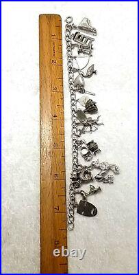 Vintage Sterling Silver 16 Pieces Charm 7.5 Bracelet 46.6 Grams Vintage Sterling Silver 16 Pieces Charm 7.5 Bracelet 46.6 Grams