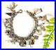 Vintage-Sterling-Silver-Charm-Bracelet-7-1-2-Lg-15-Charms-42-7-Grams-01-wz