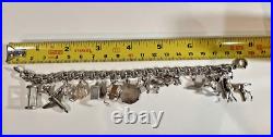 Vintage Sterling Silver Charm Bracelet 7-1/2 Lg 15 Charms 42.7 Grams Vintage Sterling Silver Charm Bracelet 7-1/2 Lg 15 Charms 42.7 Grams