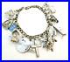 Vintage-Sterling-Silver-Charm-Bracelet-with-15-Sterling-Charms-7-Circa-1960s-01-nk