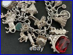 Vintage Sterling Silver Charm Bracelet with 23 Silver Charms. 84 grams