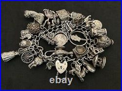 Vintage Sterling Silver Charm Bracelet with 27 Silver Charms. 101 grams