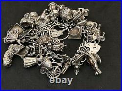 Vintage Sterling Silver Charm Bracelet with 27 Silver Charms. 101 grams