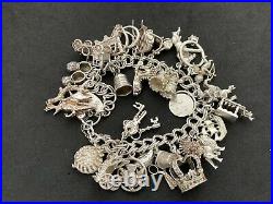 Vintage Sterling Silver Charm Bracelet with 28 Silver Charms. 94 grams