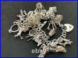 Vintage Sterling Silver Charm Bracelet with 28 Silver Charms. 94 grams