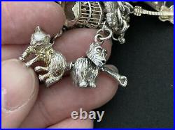 Vintage Sterling Silver Charm Bracelet with 30 Silver Charms. 80 grams