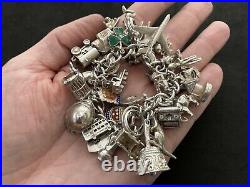 Vintage Sterling Silver Charm Bracelet with 33 Silver Charms. 99 grams