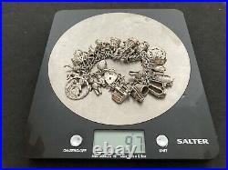 Vintage Sterling Silver Charm Bracelet with 34 Silver Charms. 97 grams