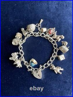 Vintage silver 925 bracelet 14 charms some rare with lock and safety chain 54.5g