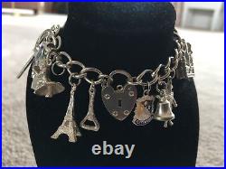 Vintage silver charm bracelet with 16 charms