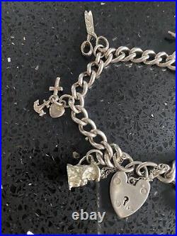 Vintage silver charm bracelet with charms