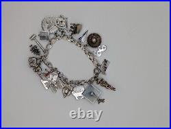 Vintage sterling silver charm bracelet loaded 49.1 g total weight wearable