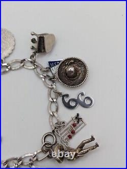 Vintage sterling silver charm bracelet loaded 49.1 g total weight wearable