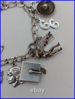 Vintage sterling silver charm bracelet loaded 49.1 g total weight wearable