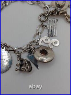 Vintage sterling silver charm bracelet loaded 49.1 g total weight wearable