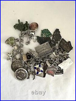 Vintage sterling silver charm bracelet loaded With 30 Charms 79.83g