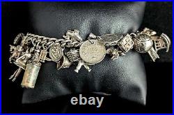 Vintage sterling silver charm bracelet, loaded, heavy