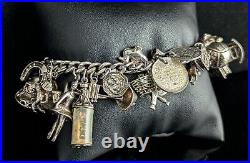 Vintage sterling silver charm bracelet, loaded, heavy