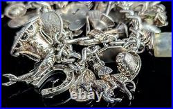 Vintage sterling silver charm bracelet, loaded, heavy