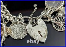 Vintage sterling silver charm bracelet, loaded, heavy