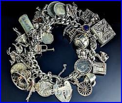 Vintage sterling silver charm bracelet, loaded, heavy