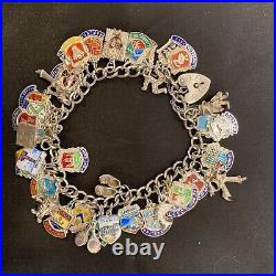 Vintage sterling silver charm bracelet with approx 40 vintage enamel charms