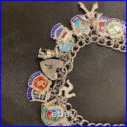 Vintage sterling silver charm bracelet with approx 40 vintage enamel charms