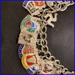 Vintage sterling silver charm bracelet with approx 40 vintage enamel charms