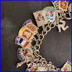 Vintage sterling silver charm bracelet with approx 40 vintage enamel charms