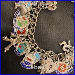 Vintage sterling silver charm bracelet with approx 40 vintage enamel charms