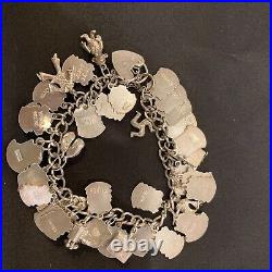 Vintage sterling silver charm bracelet with approx 40 vintage enamel charms