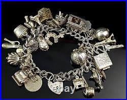 Vintage sterling silver loaded charm bracelet, heavy
